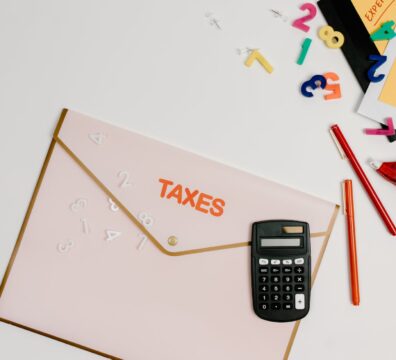 black and gray calculator on white printer paper