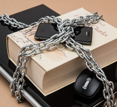 black android smartphone on top of white book